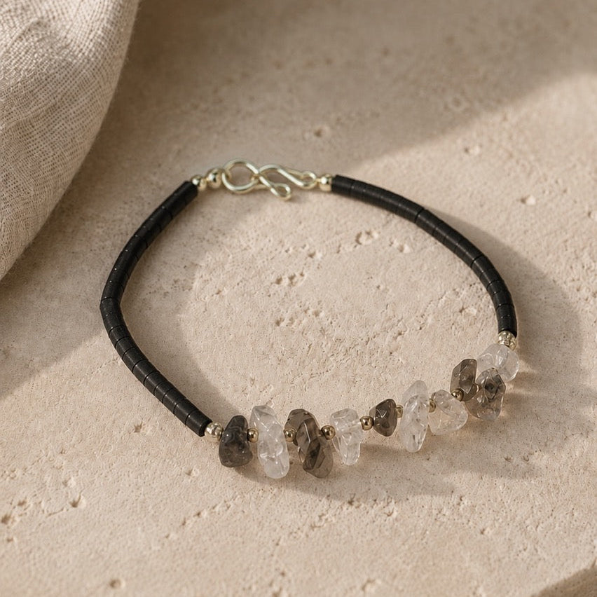 Bracelet with natural stone beads on a beige surface