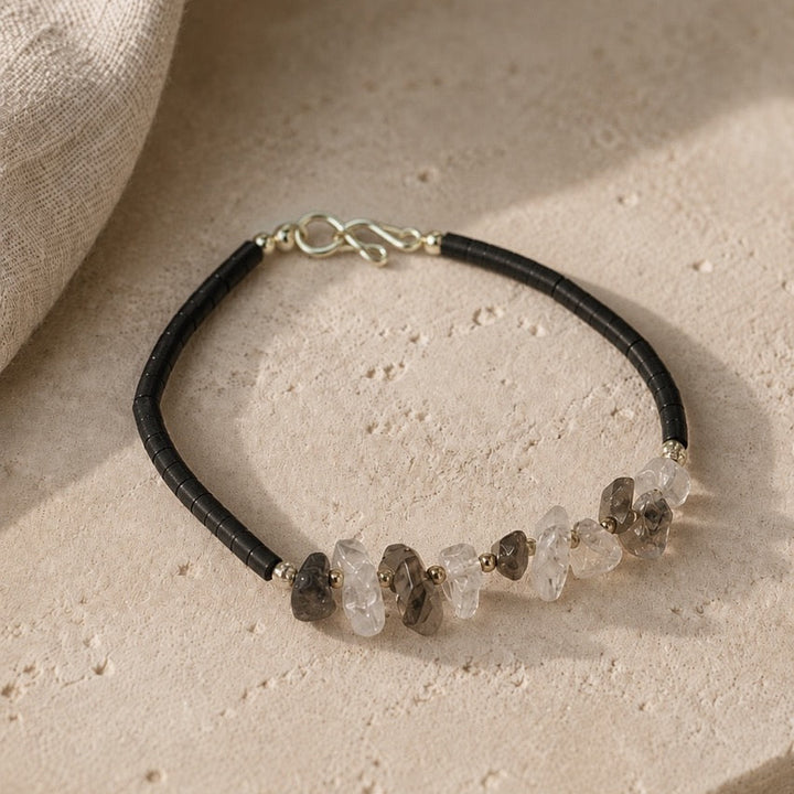 Bracelet with natural stone beads on a beige surface